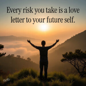 Person standing at sunrise on a cliff edge with open arms, symbolizing courage, growth, and the power of taking risks.